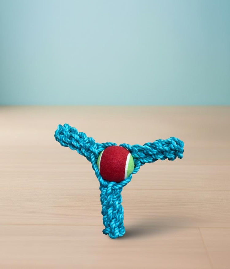 Juguete de cuerda con pelota